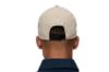 Blæst Hatlane Caps i beige, en vanntett og pustende caps med klassisk design og justerbar passform.