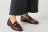 Tamaris brun loafer til dame i skinn med dekorativ metallspenne og TOUCH-IT-innersåle.
